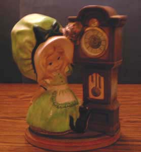 Ceramic Girl with Green Hat & a Clock Pic 1