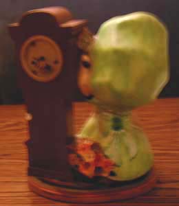 Ceramic Girl with Green Hat & a Clock Pic 2
