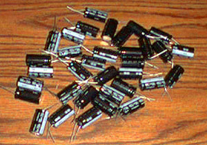 Lot of 34: Nichicon 100uF 250V Radial Electrolytic Capacitors Pic 1